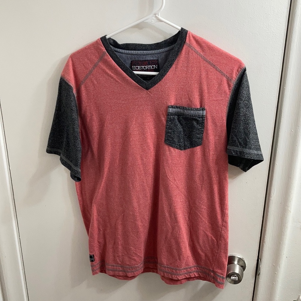 coral pink shirt with short gray sleeves